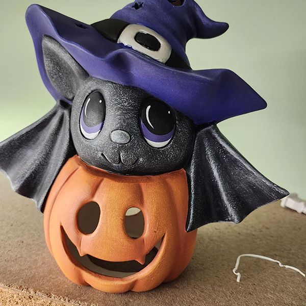 bat-on-pumpkin46212764-3507-D636-FCAA-A6494176D844.jpg